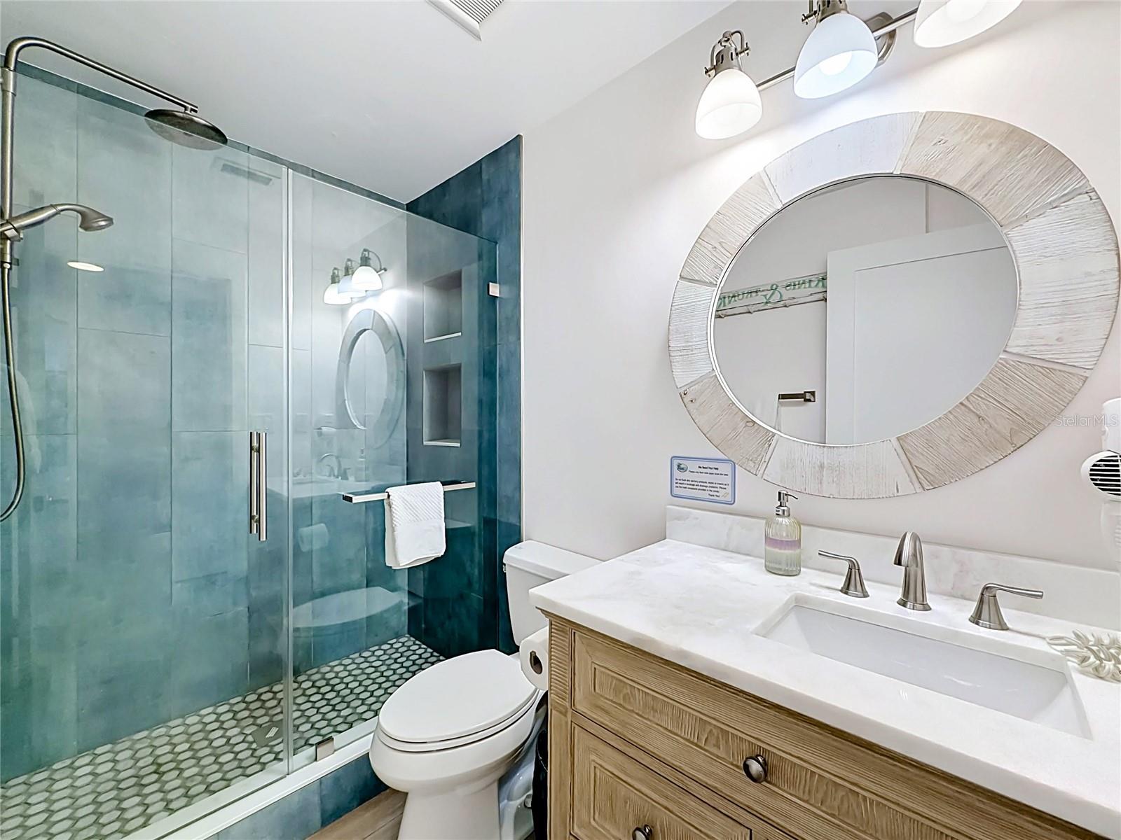 The newly remodeled bathroom has a walk-in shower.