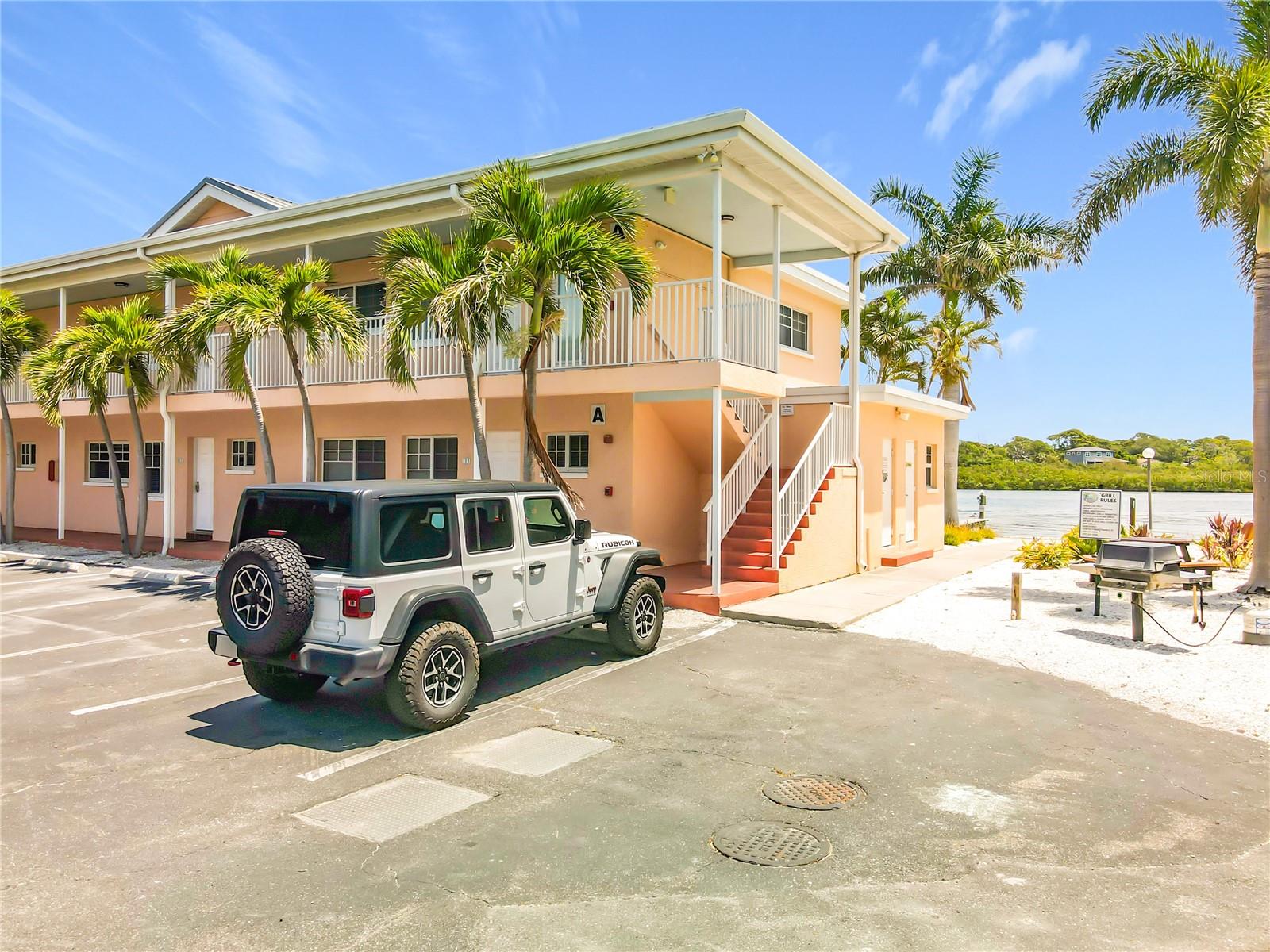 This condo unit is an end unit so you won't have another unit on one side of your unit.  Notice one of Barefoot Beach Resort's picnic area that is located right next to your condo building.