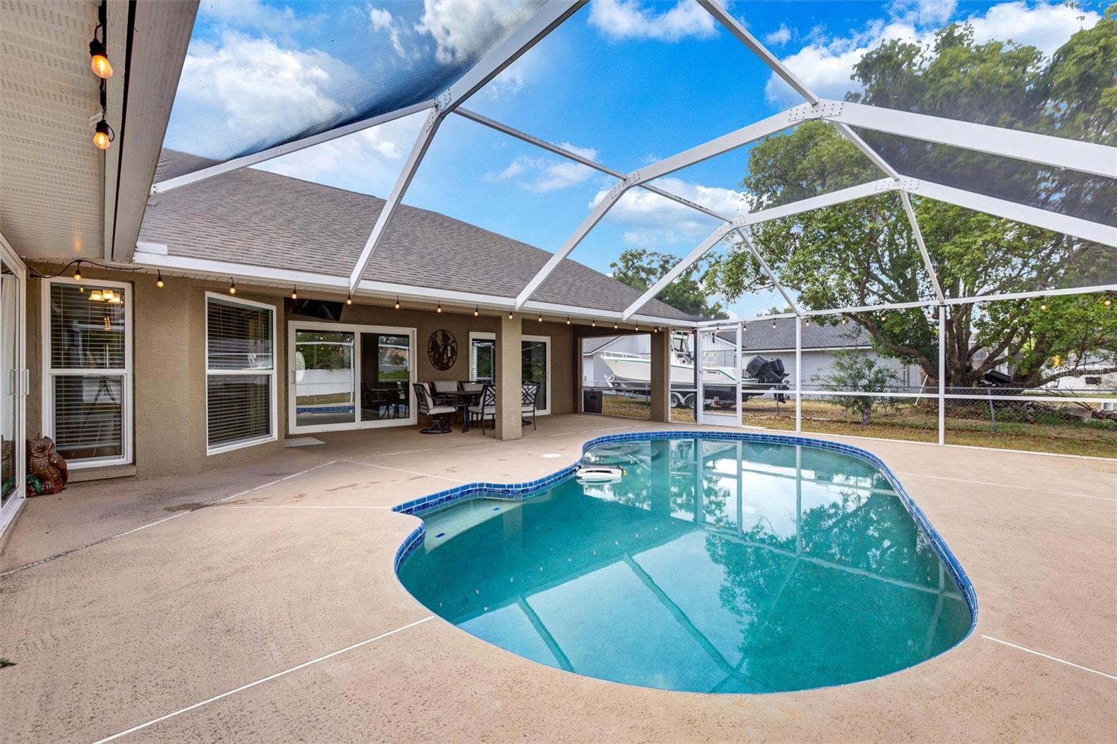 Pool area with covered patio