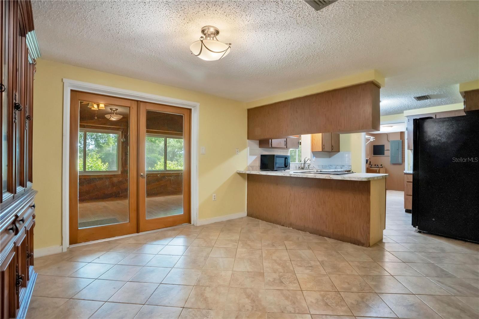 Dining Room & Kitchen; doors go out to Florida/Game Room