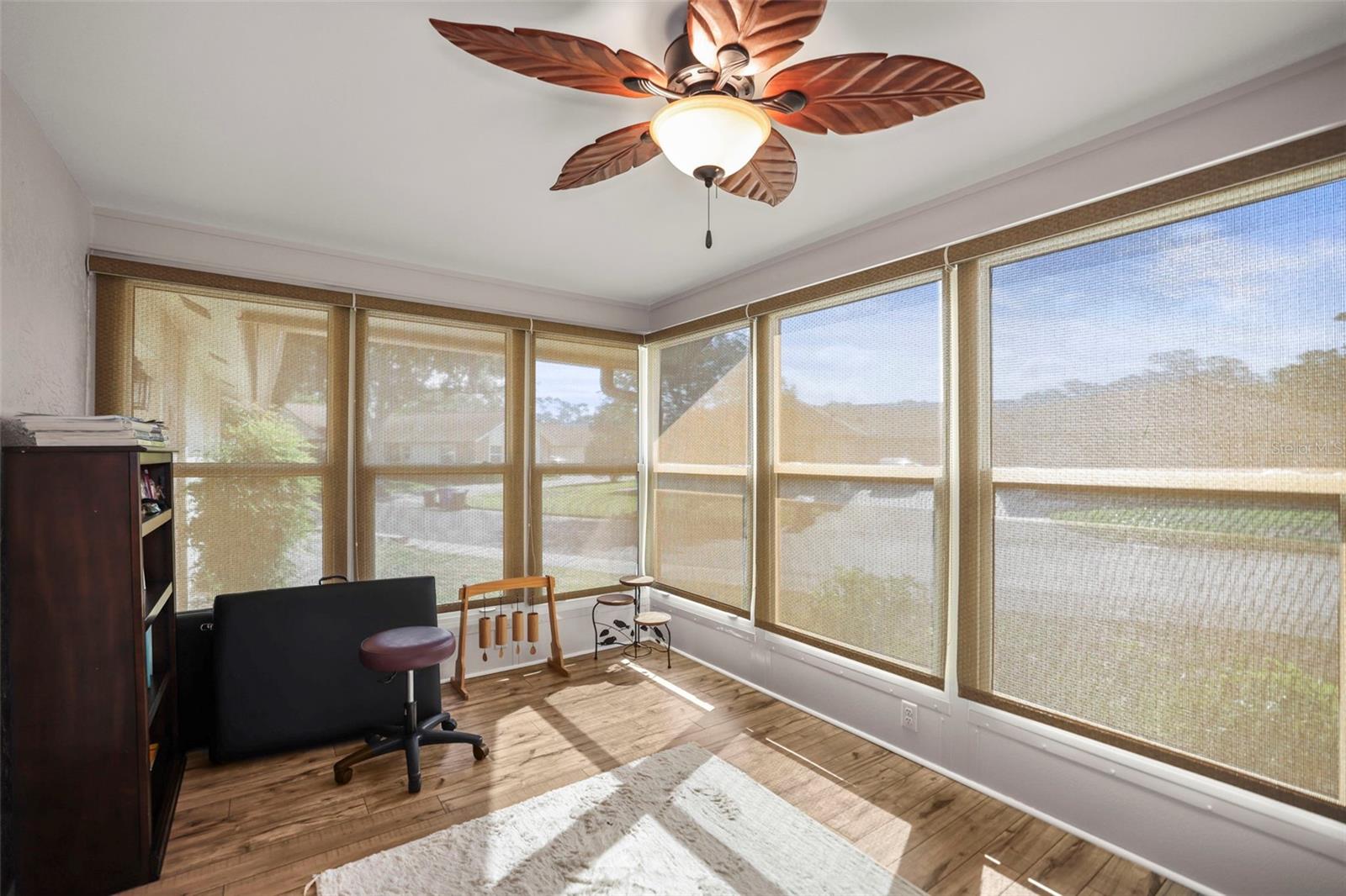 Enclosed lanai - bright and sunny, Could be an office, sitting room, library or guest space.