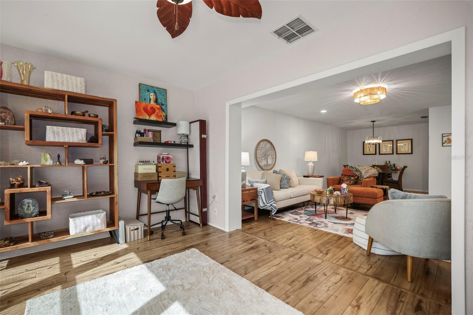 Enclosed lanai, engineered hardwood. multiple possibilities open to the living room.
