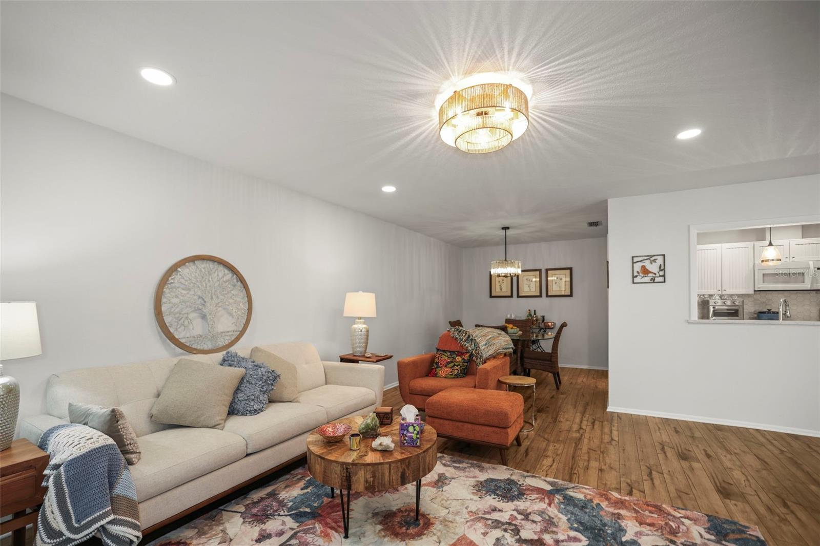 Living room / Dining Room combo with view of kitchen passthrough