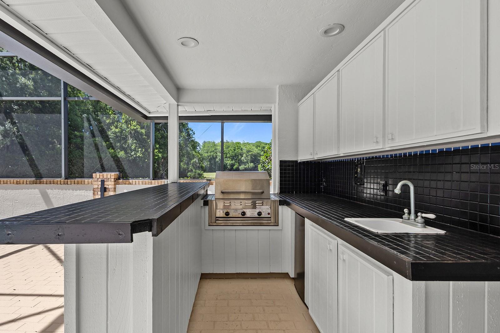 Outdoor covered kitchen with full bathroom