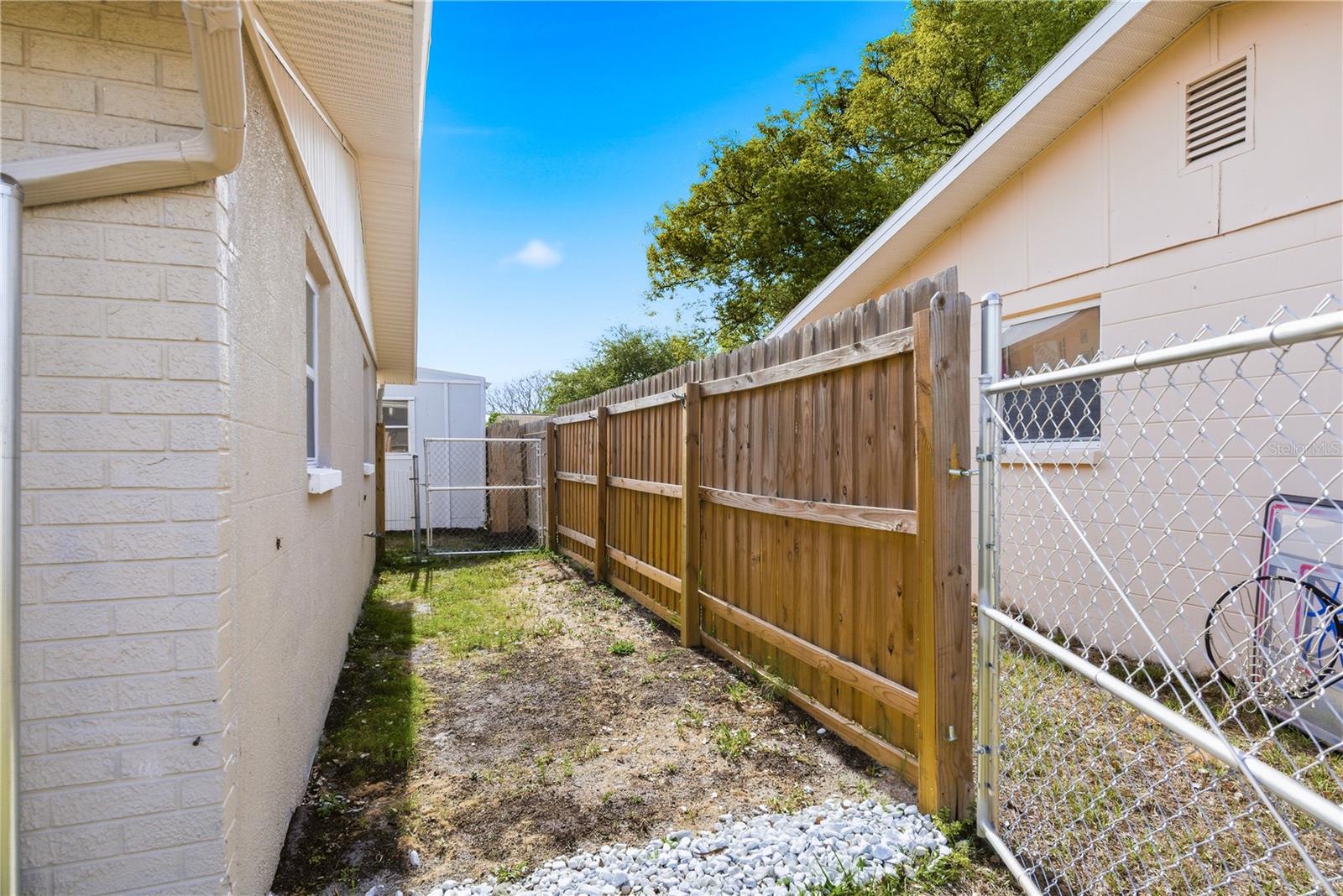 Boat or trailer storage on side of house