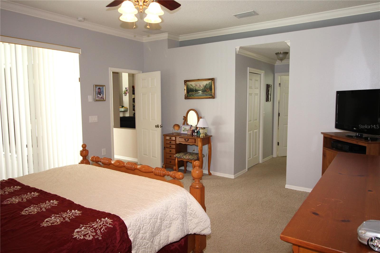 There are his & hers walk-in closet in the hallway leading to primary bath