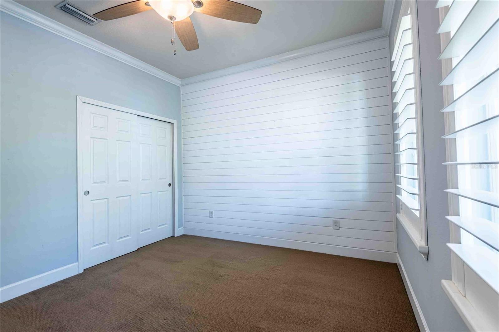 Second bedroom overlooks the front porch.