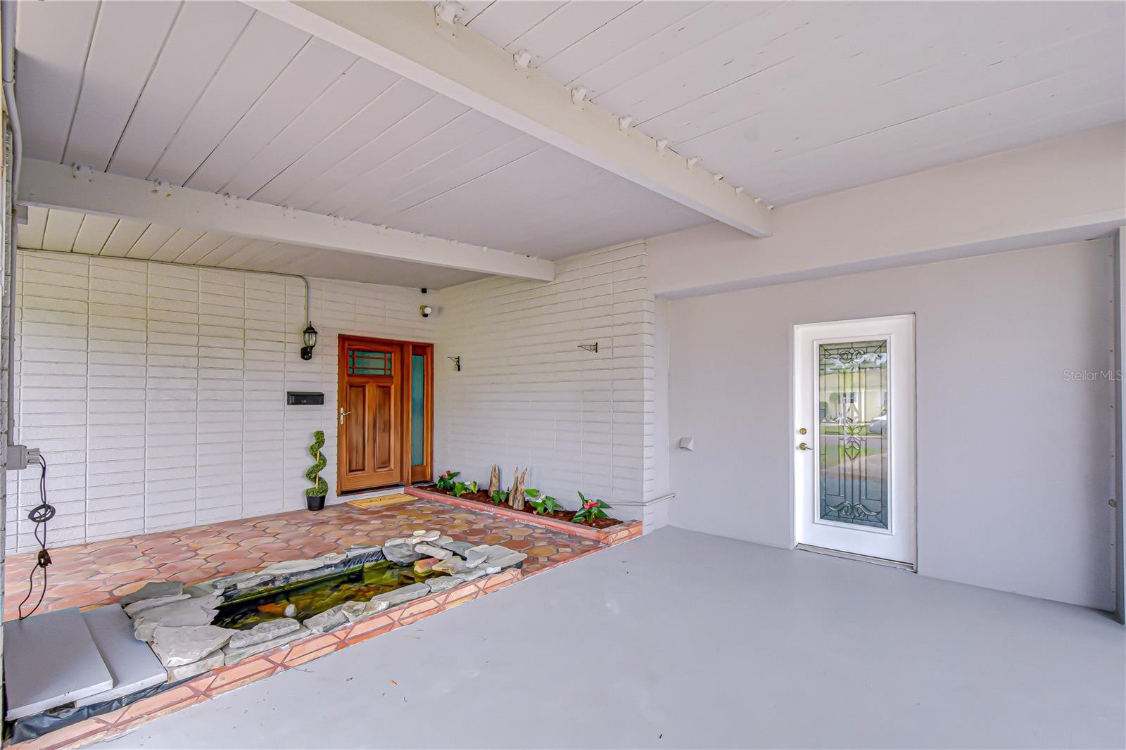 The carport area also contains a cool "koi pond" that is fully functional.