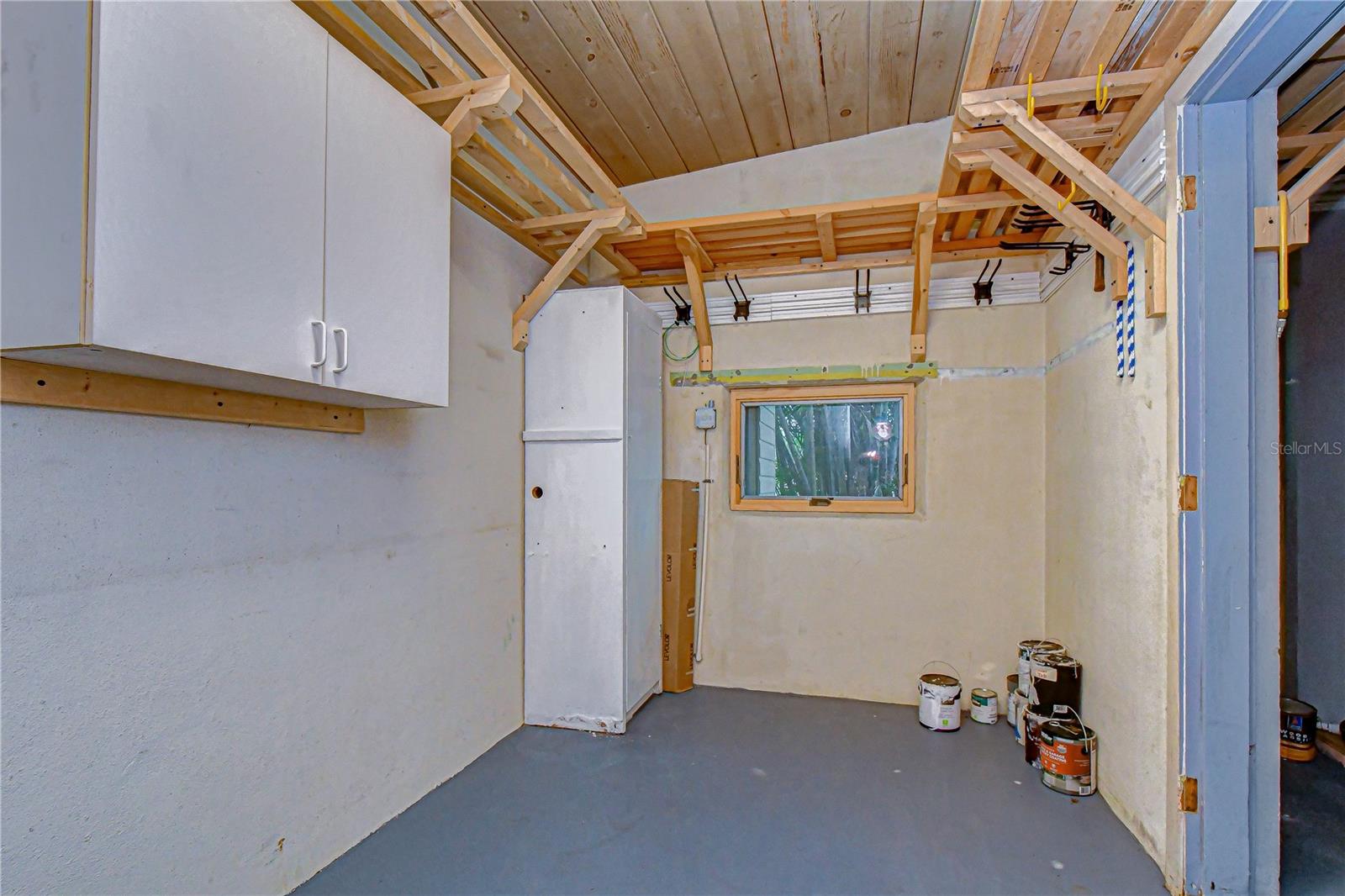 additional storage or unfinished "mud room" accessible via the carport.