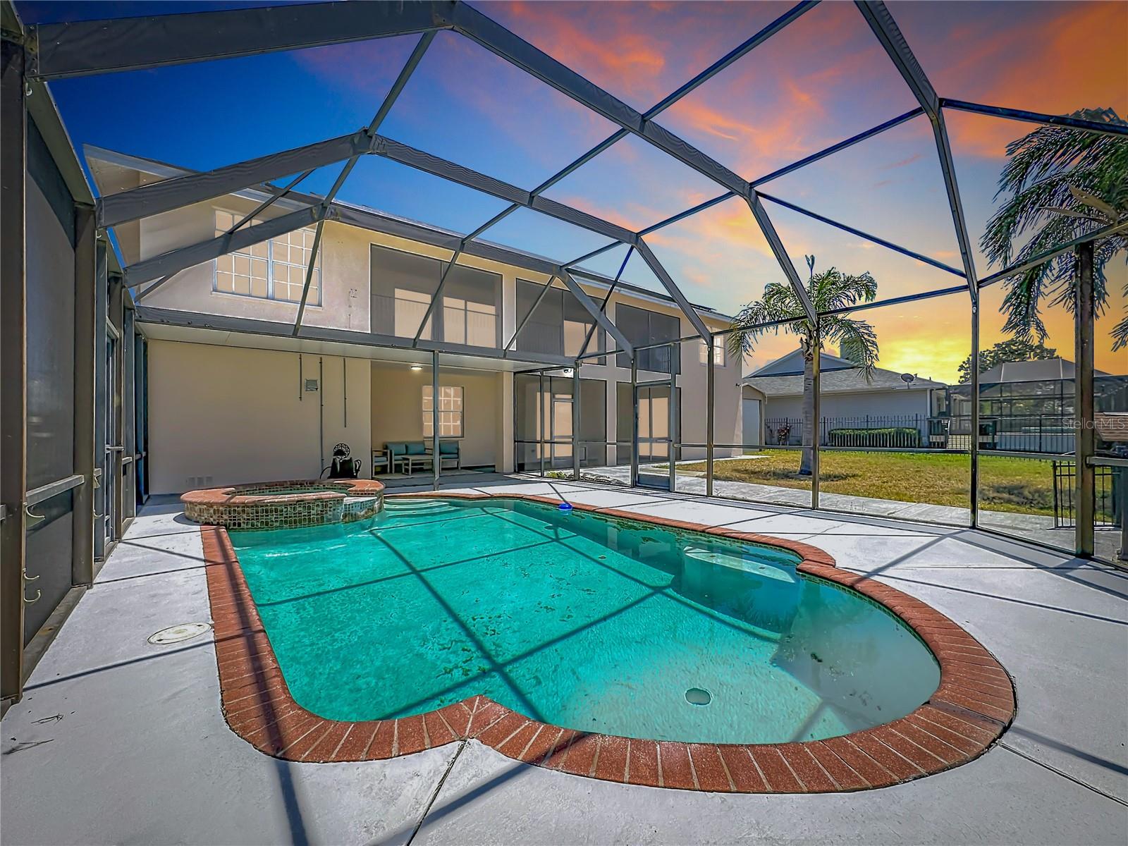 Screened pool overlooking deep water canal