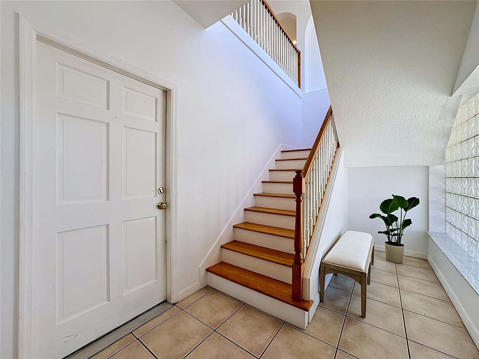 Staircase leading up to main living and owners retreat