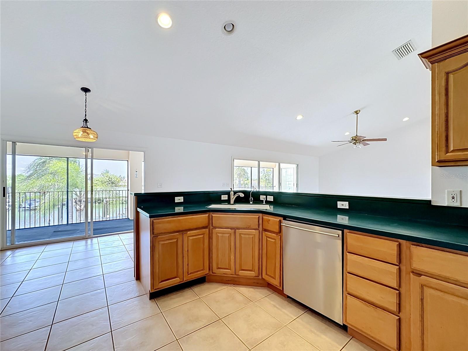 Spacious kitchen with breakfast bar and ample cabinet storage