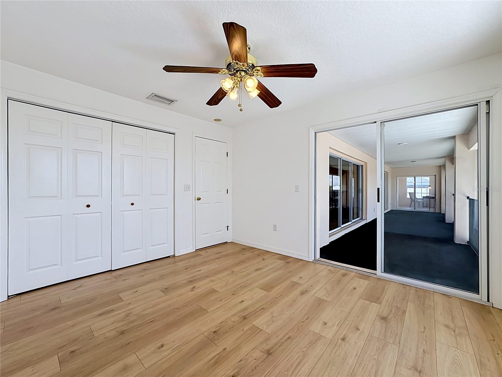 Walk out to the sceened area from this bedroom
