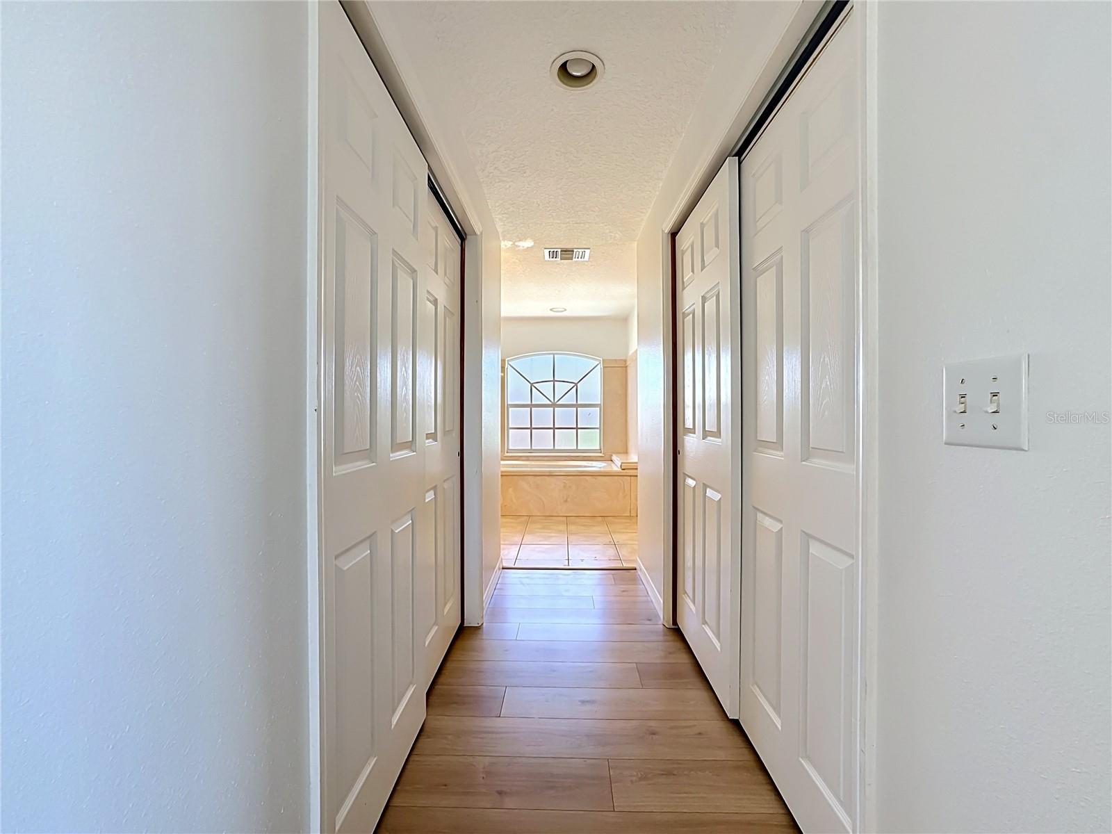 Hallway connecting owners sutie to owners bath