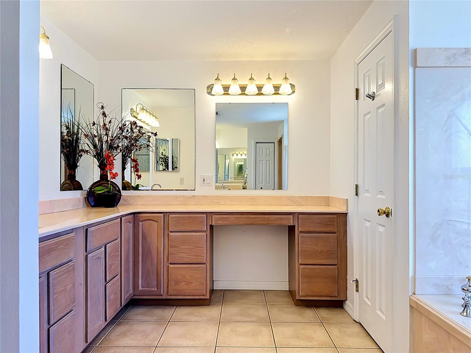 Owners suite vanity with makeup space