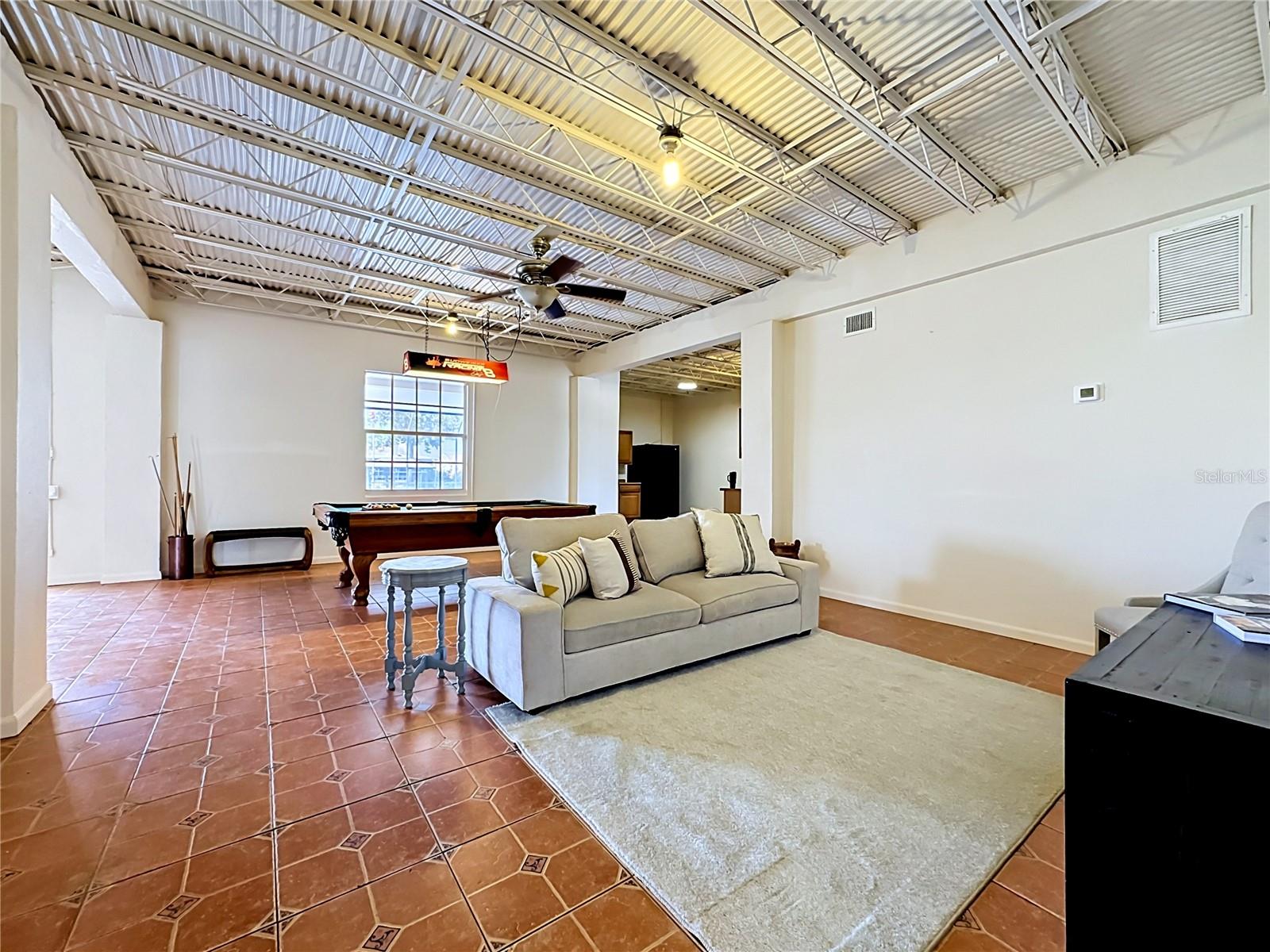 Downstairs bonus flex space with full kitchenette and game area