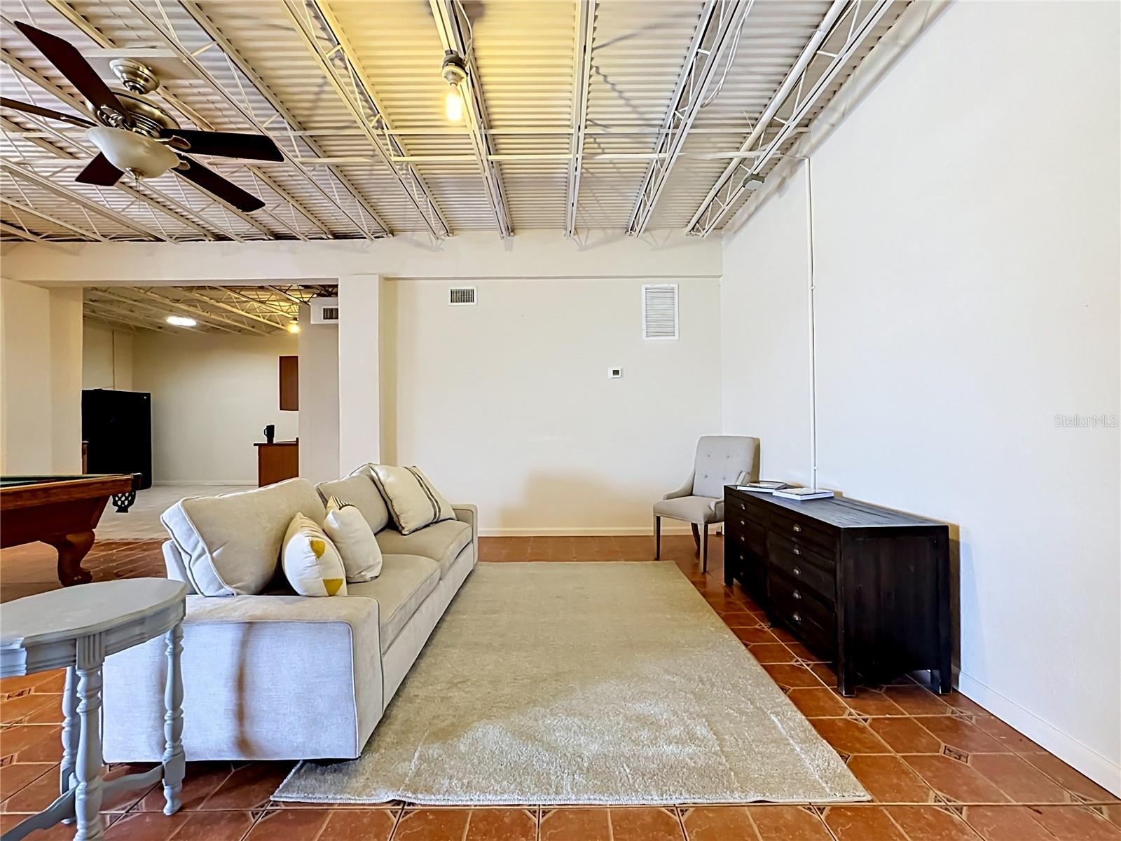 Downstairs bonus flex space with full kitchenette and game area