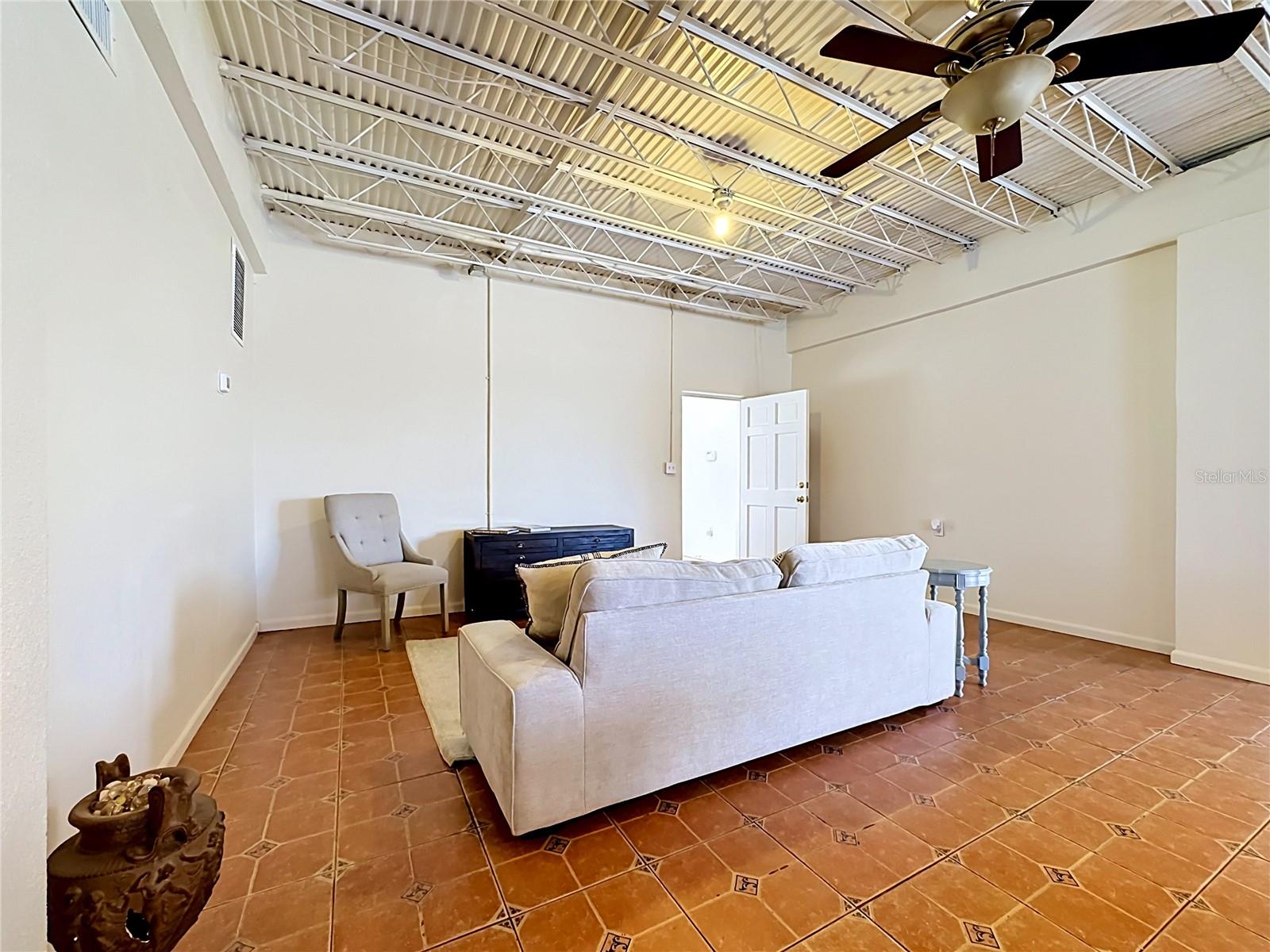 Open downstairs flex space with vaulted ceiling