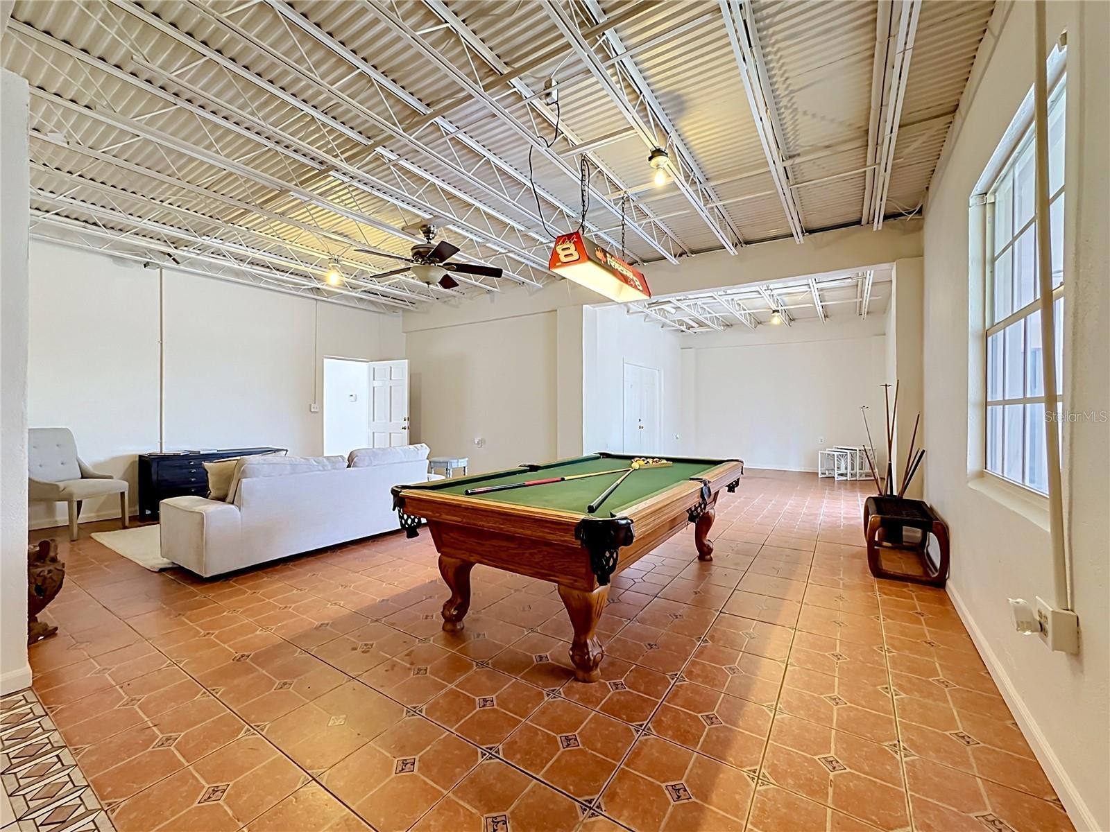 Open downstairs flex space with vaulted ceiling