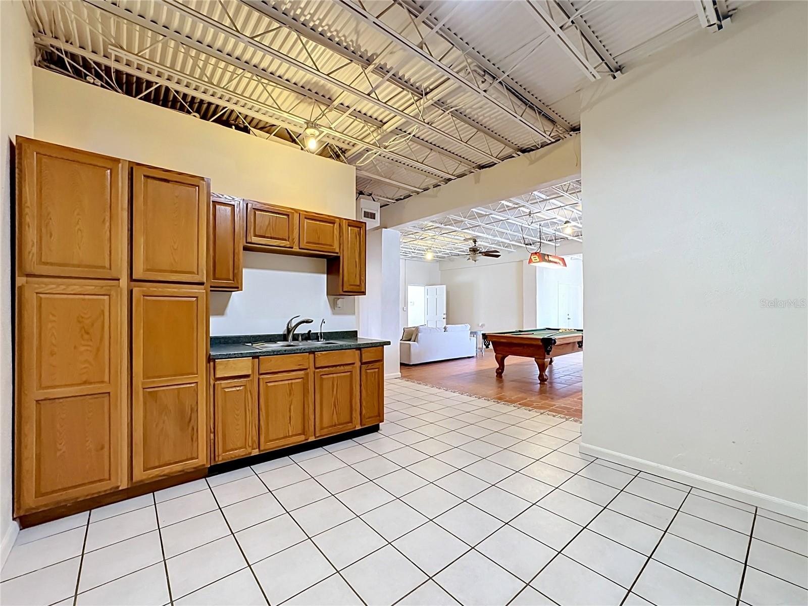 Full kitchenette in the downstairs flex space
