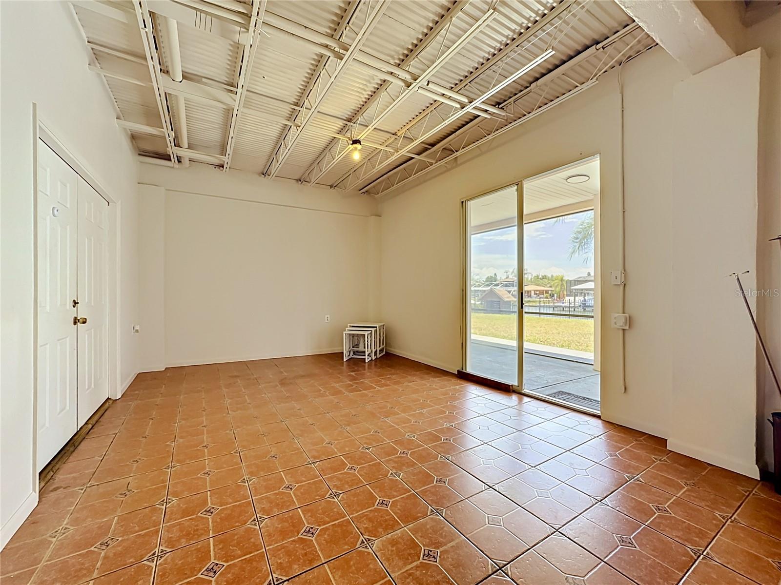 Downstairs flex space with ceramic flooring
