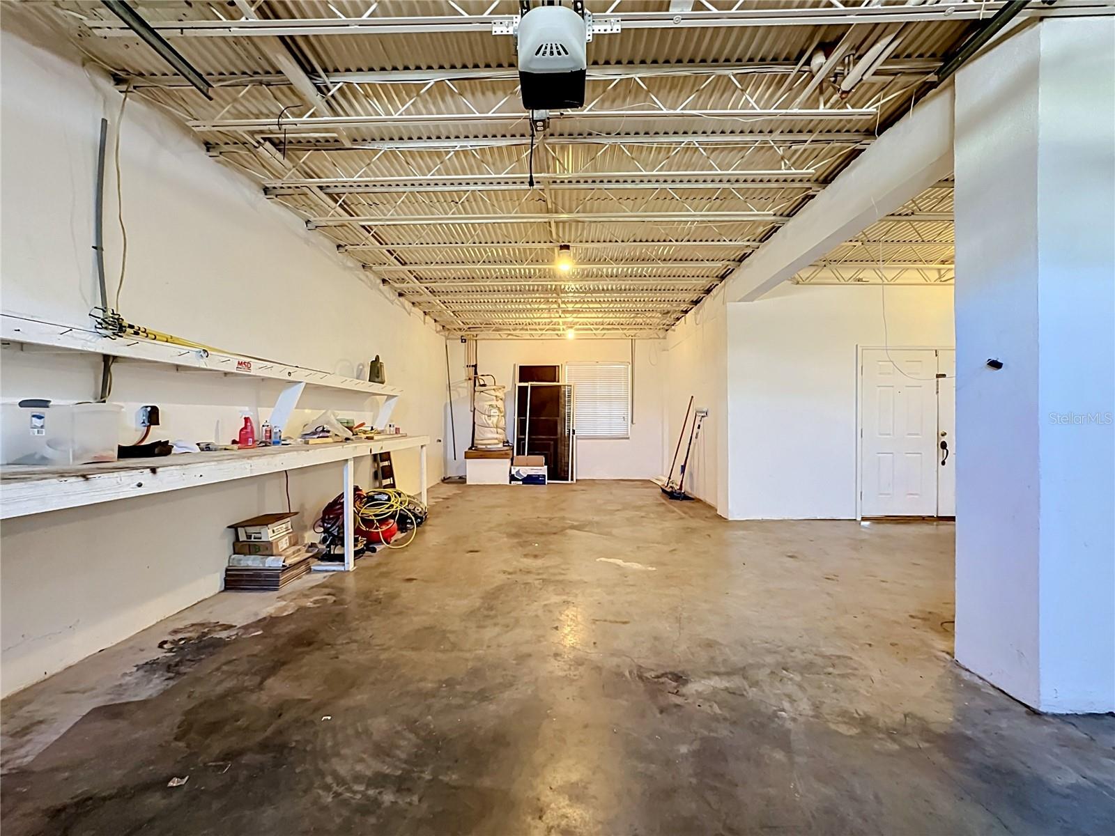 3-car garage with bay door — boater and toy collector's dream