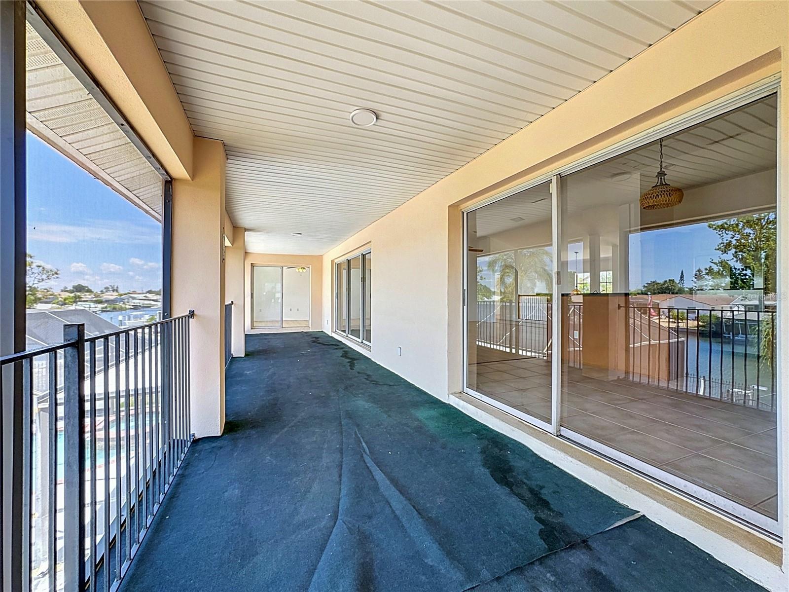 Upstairs screened balcony — perfect for sunset cocktails