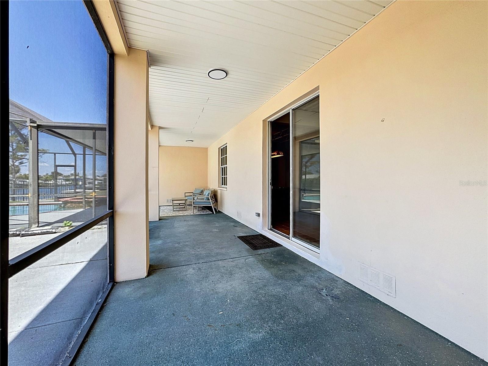 Long screened balcony spans the back of the home off the first floor