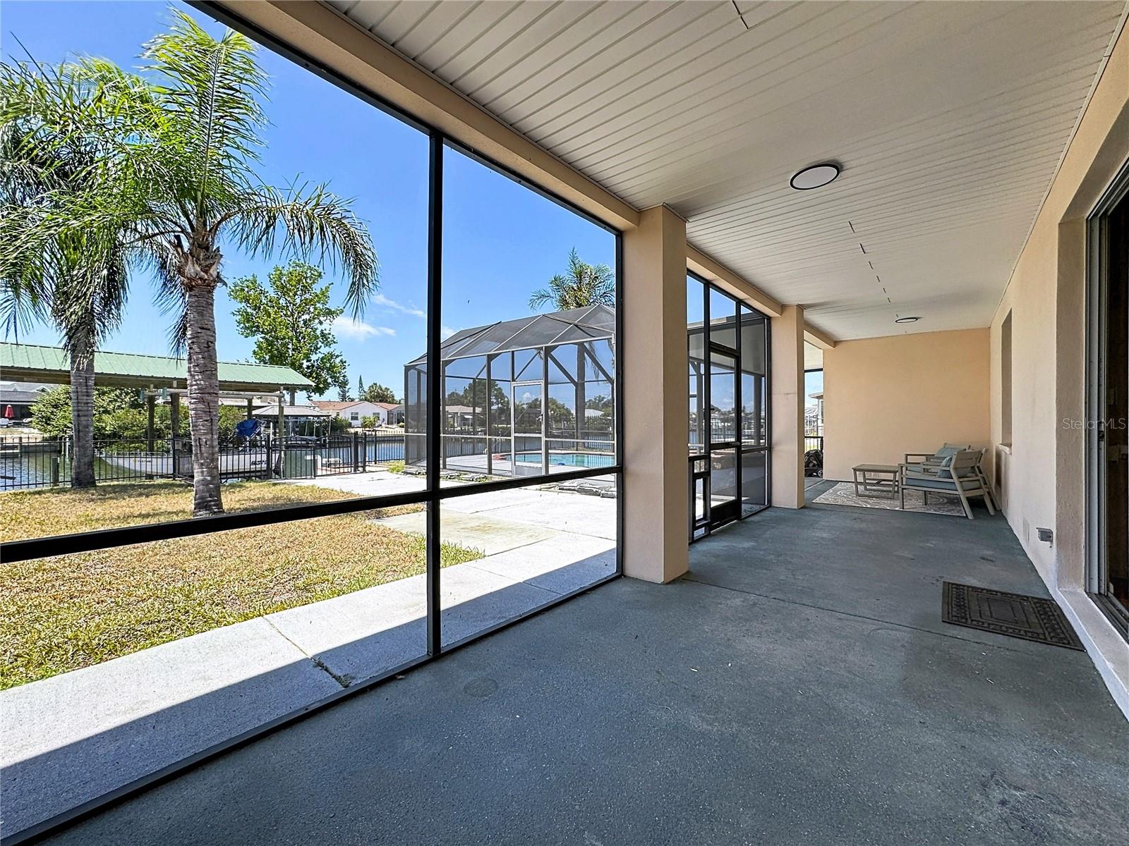 Floor-to-ceiling water views from the screened balcony first floor