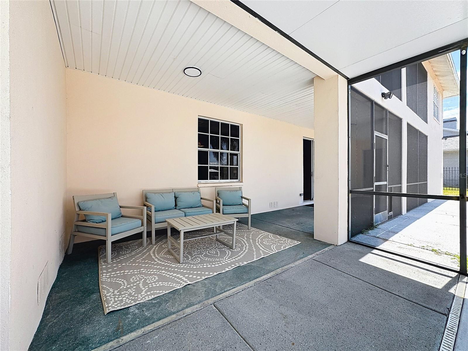 Cozy screened porch sitting area