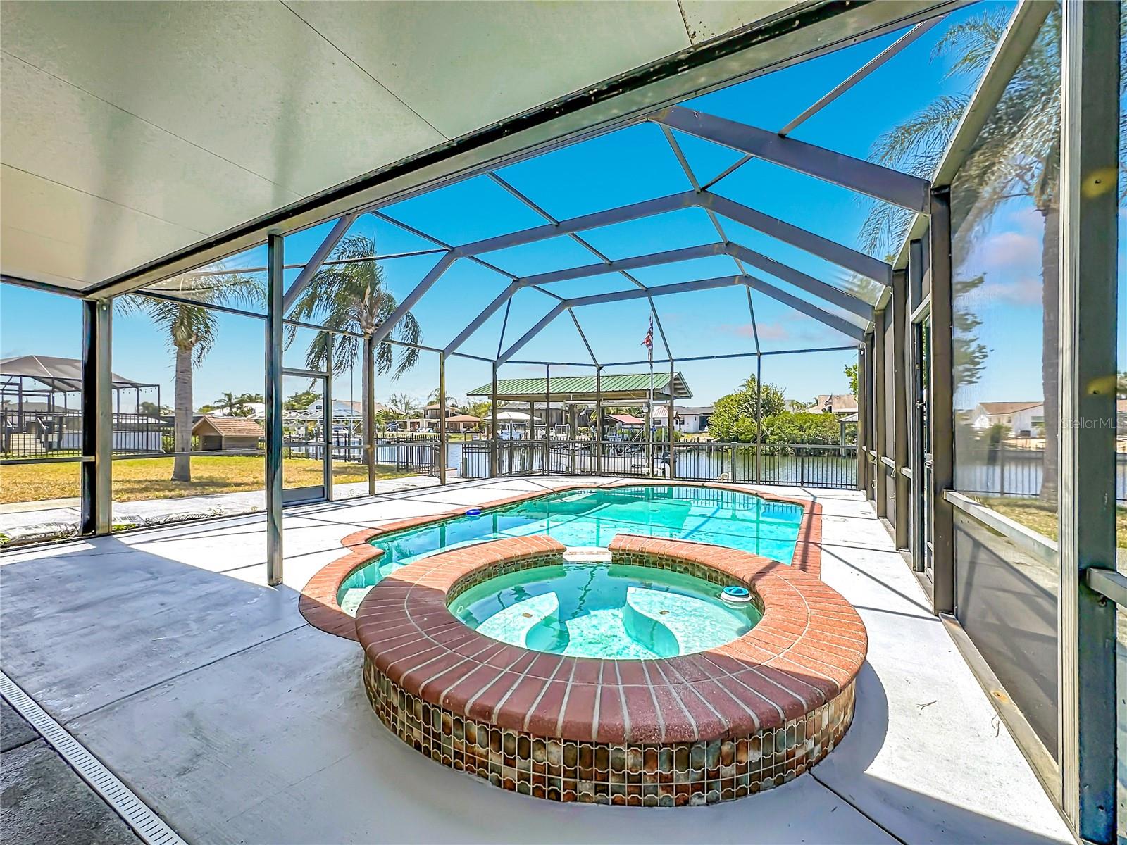 Pool and spa with poolside seating area