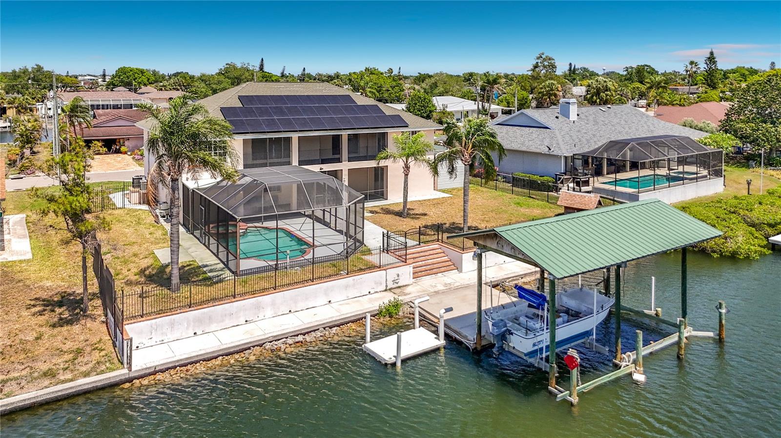 Private dock and boat lift on the deep water canal