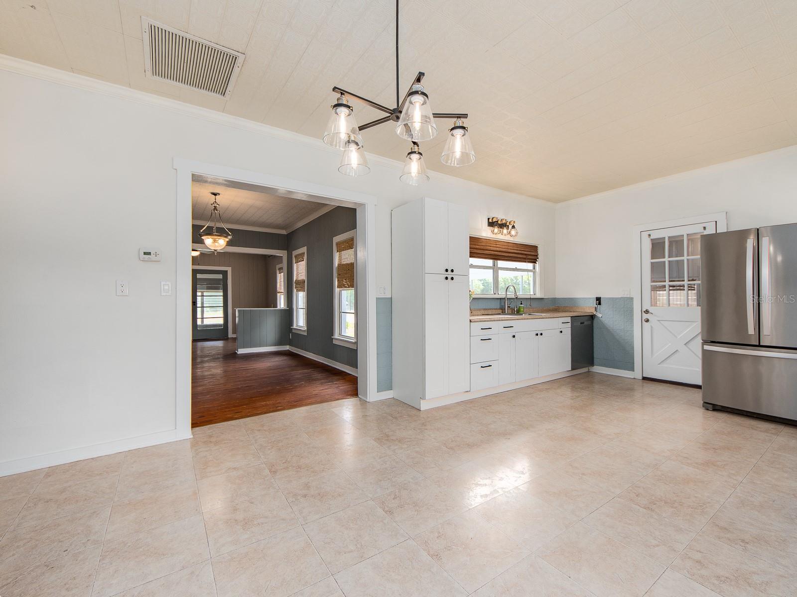 Alternate view of kitchen and dining area