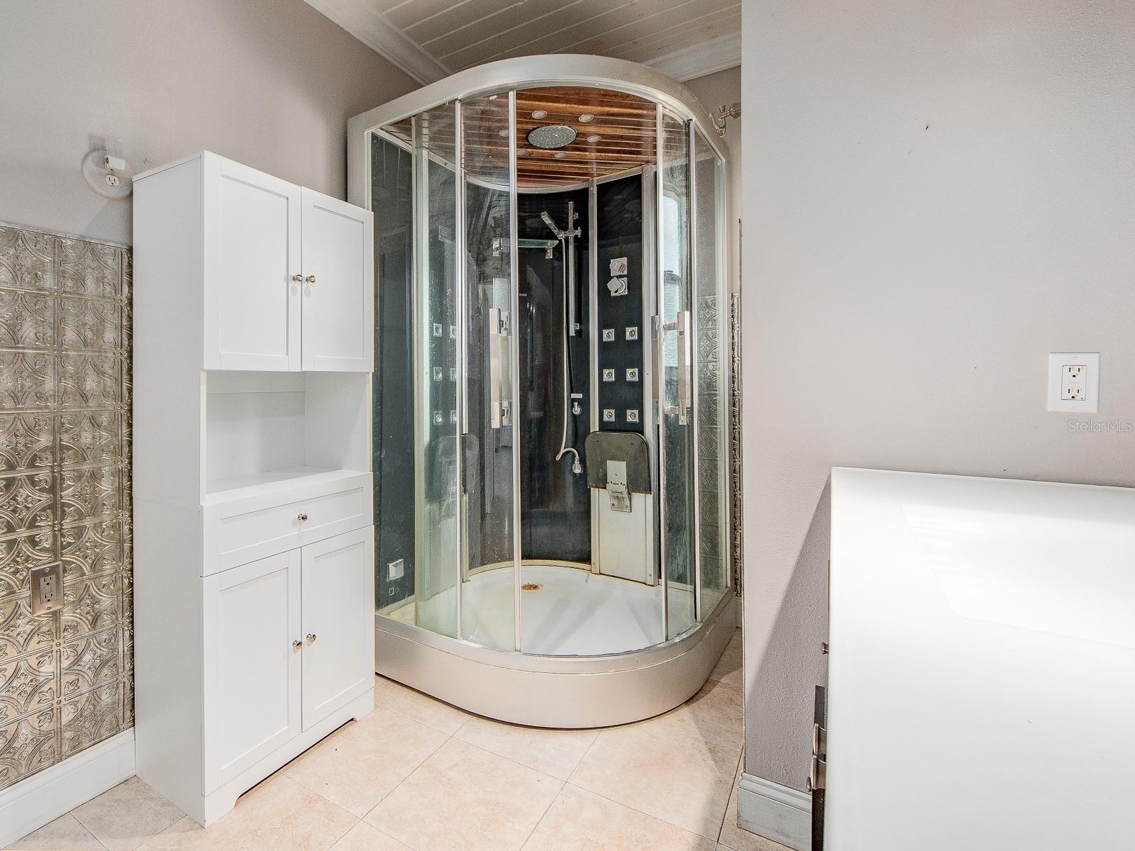 Bathroom with vanity and storage