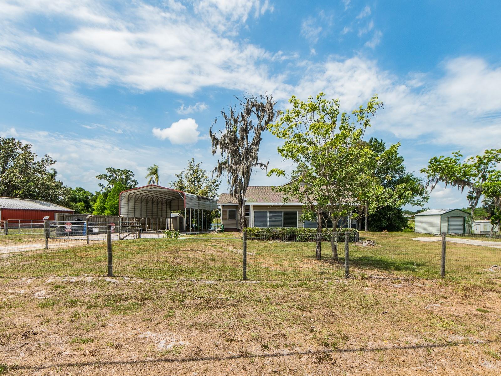 Spacious yard with mature trees
