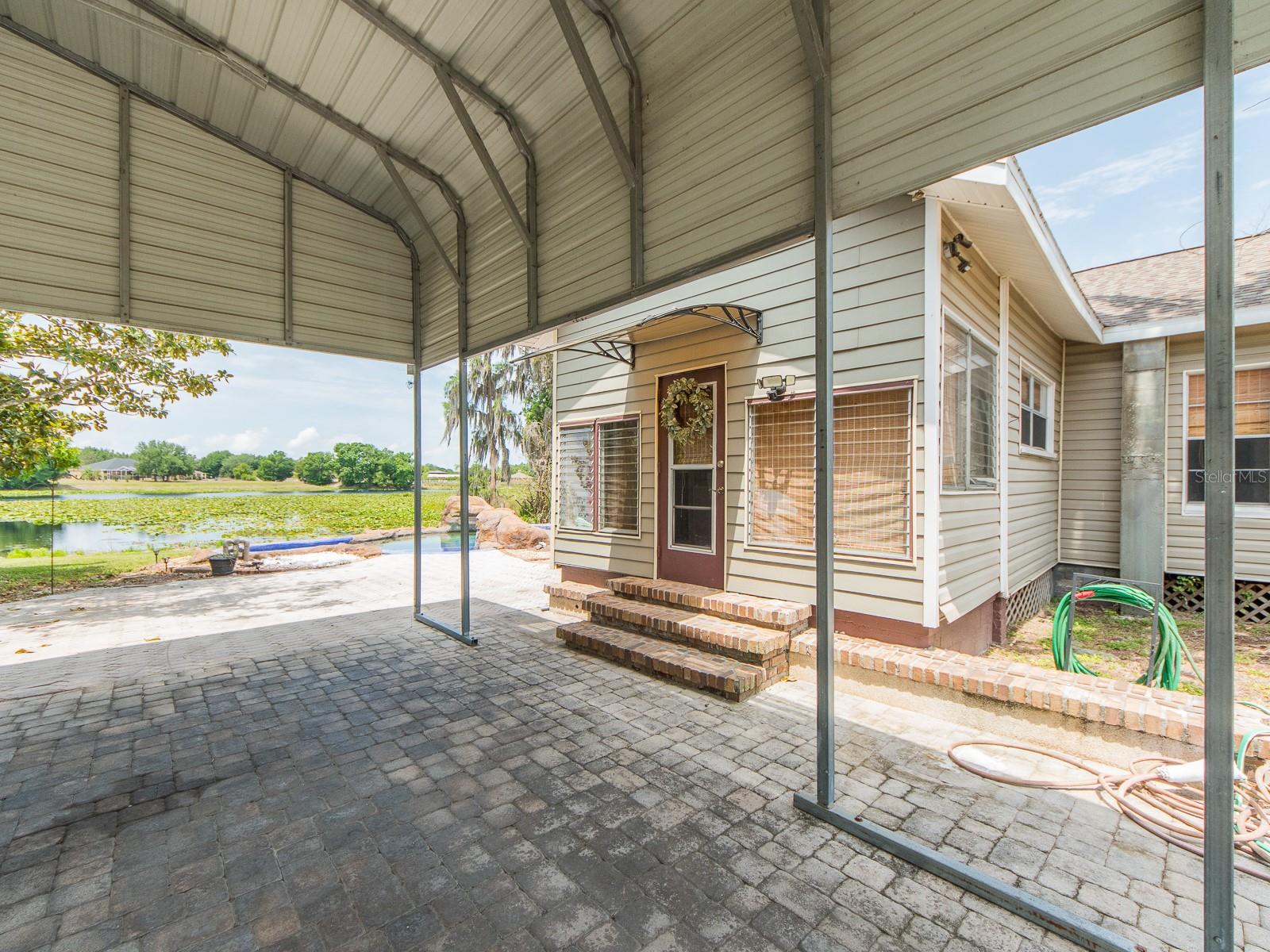 Covered carport with ample parking space