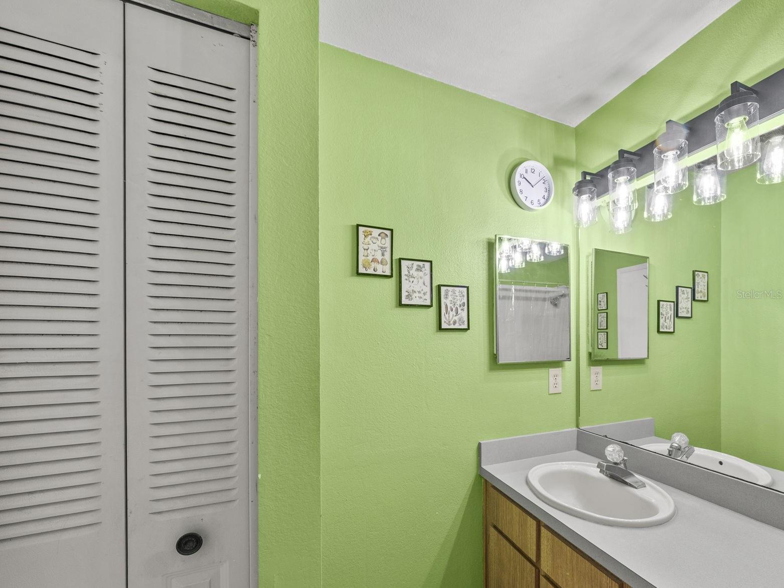 Primary bathroom with vanity and great storage.