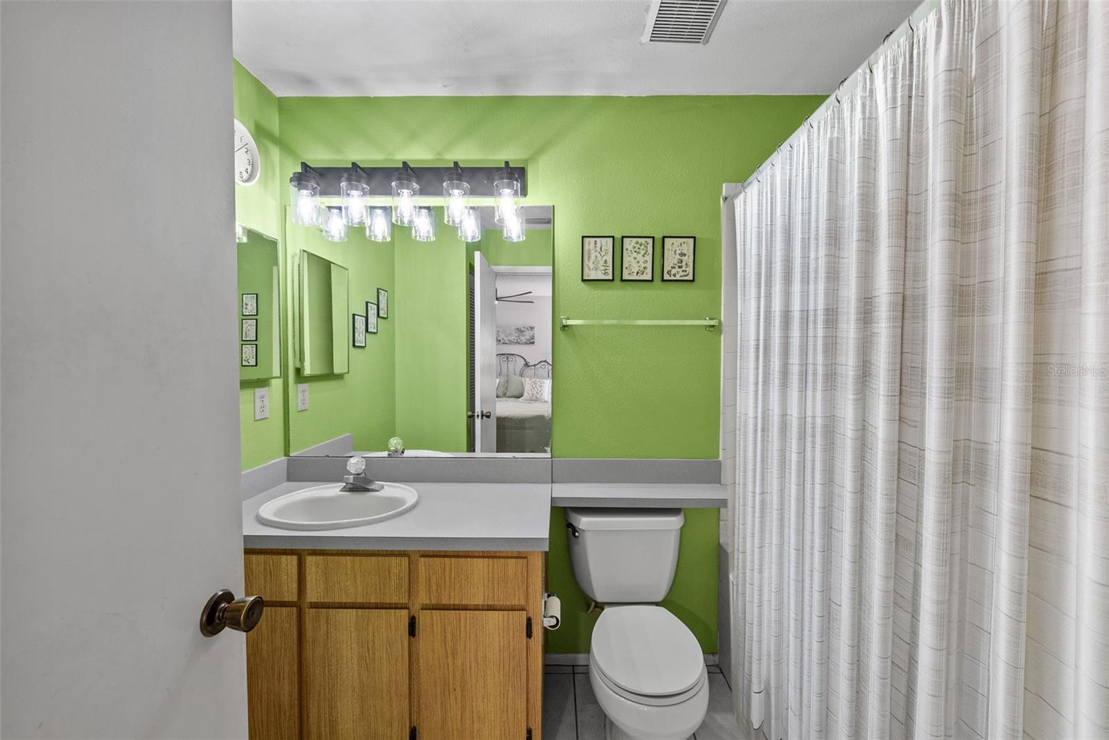 Primary bathroom with vanity and great storage.