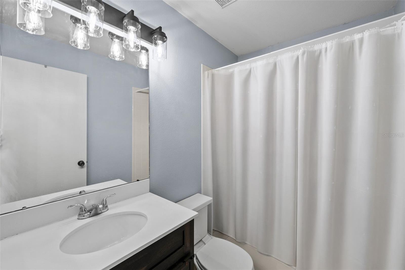 Secondary bathroom with fresh paint.