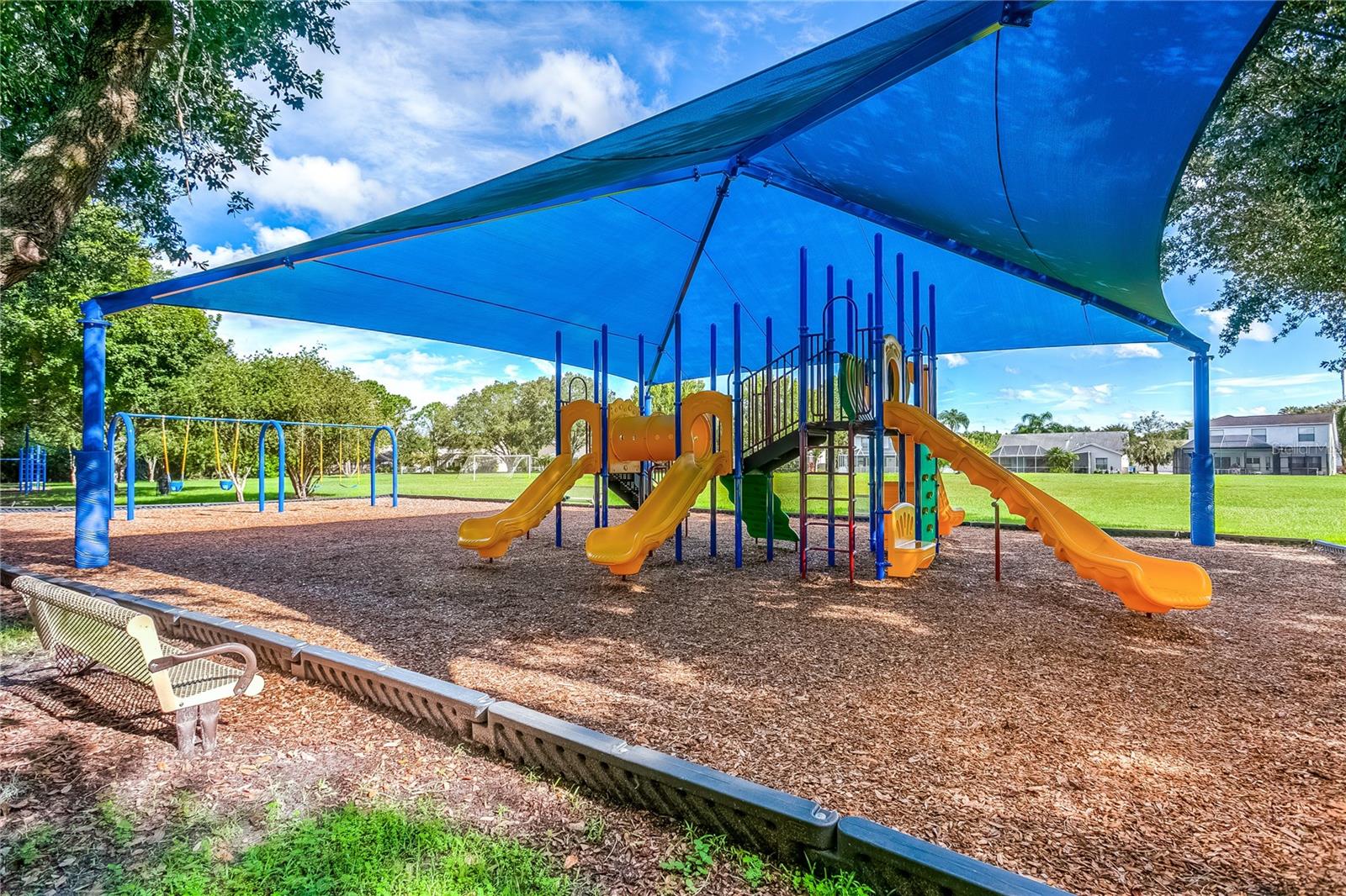 Covered playground area designed for year-round enjoyment.