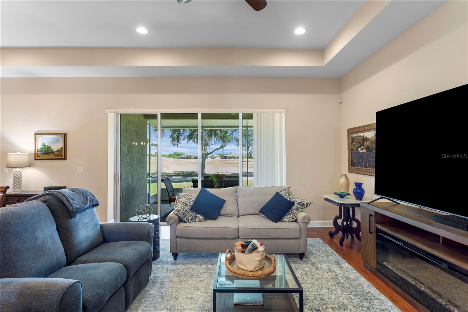 Living room to screened in lanai on Golf Course