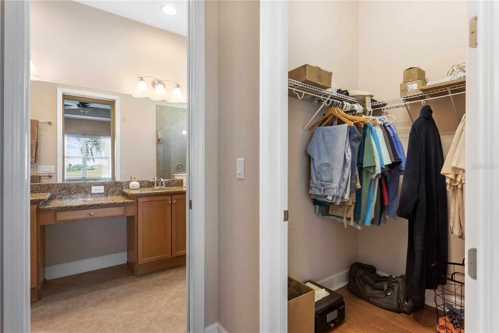 Dual walk in closets from bedroom to bathroom