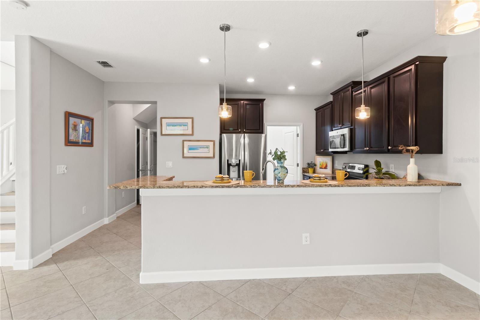 Large breakfast bar in the kitchen.  Great for setting up a buffet