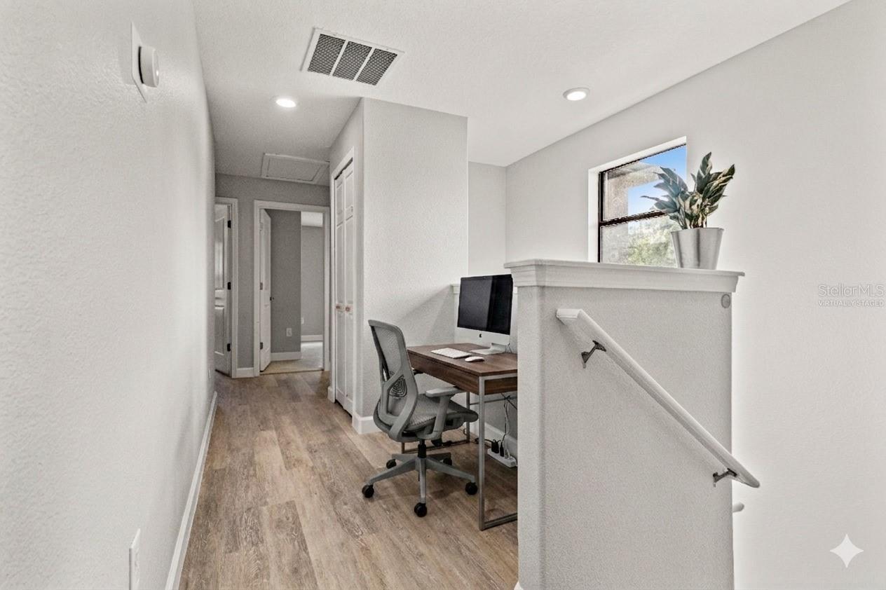 Virtually Staged desk nook at the top of the stairs