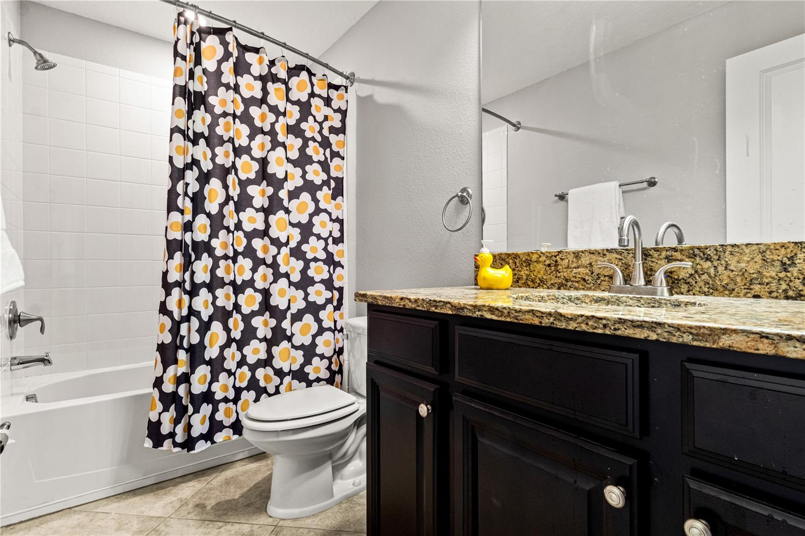 Secondary bathroom with a tub/shower combo