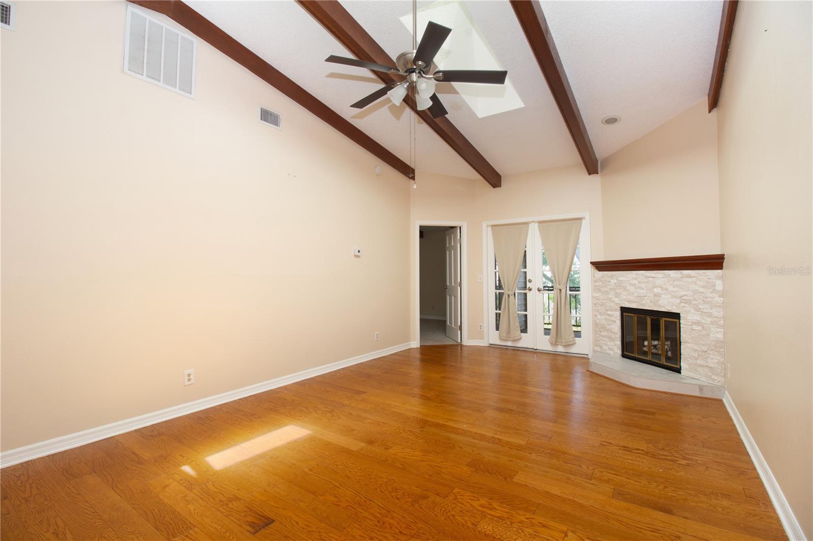 LR with Fireplace & access to Screened Porch