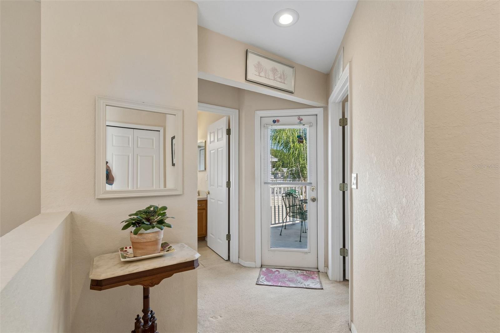 Hallway to 3rd bedroom, 2nd patio & 2nd bathroom