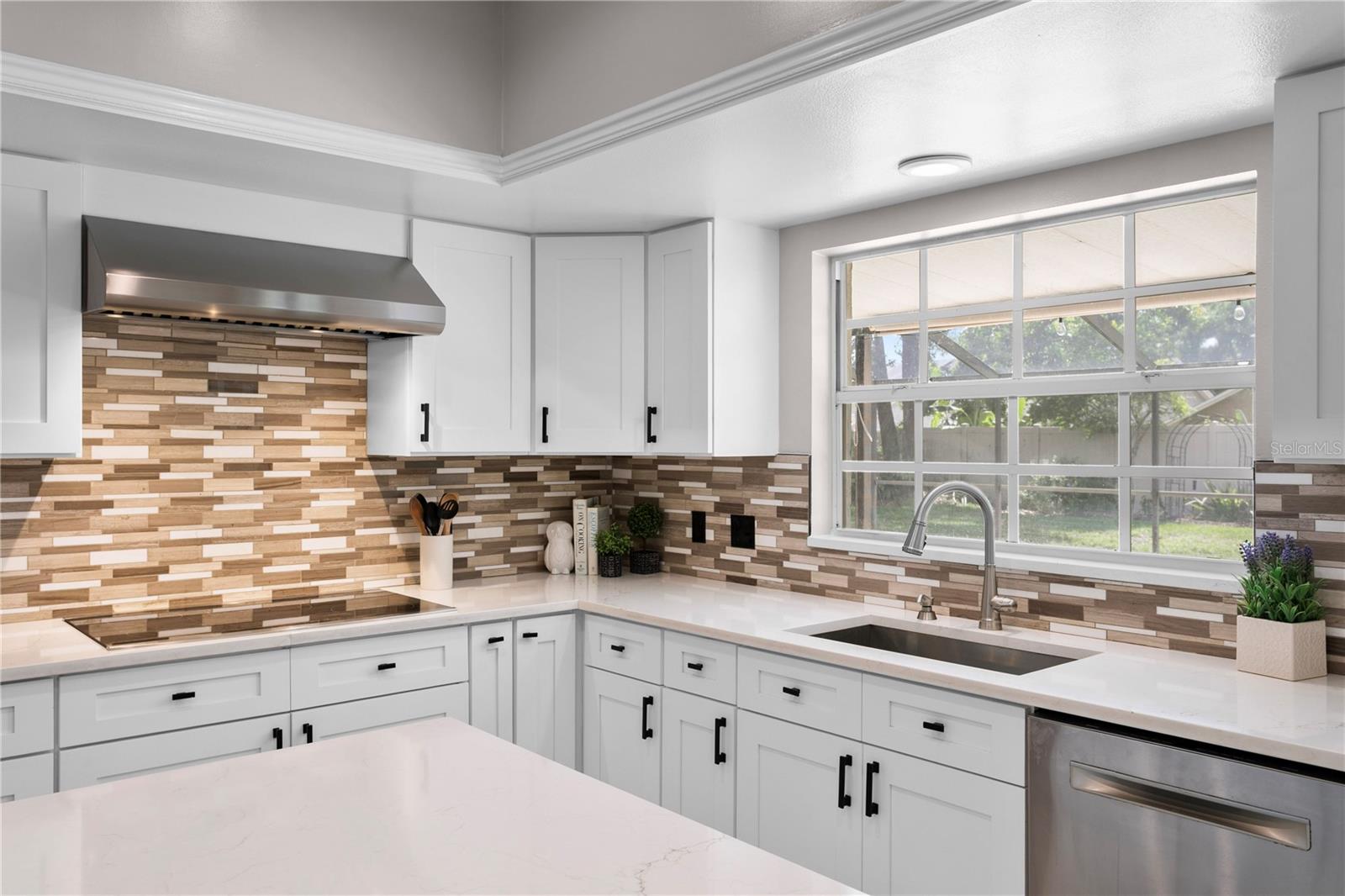 Electric cooktop with stainless steel vent hood