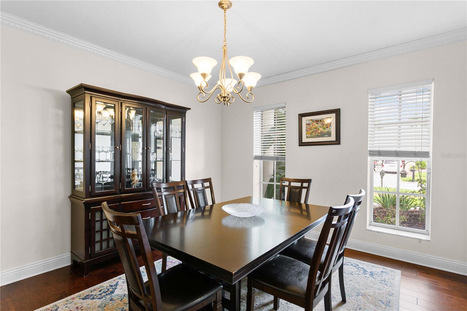 Large formal dining room with crown molding