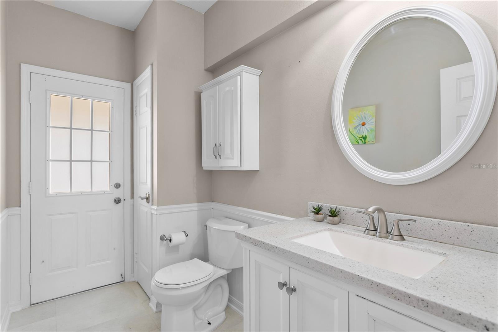 First floor pool half bath with quartz counters
